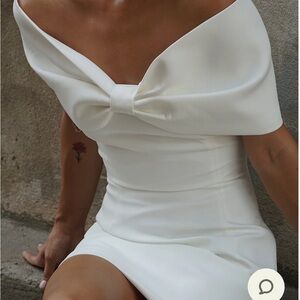 Engagement party or bachelorette, bridal white mini dress with shoulder detail